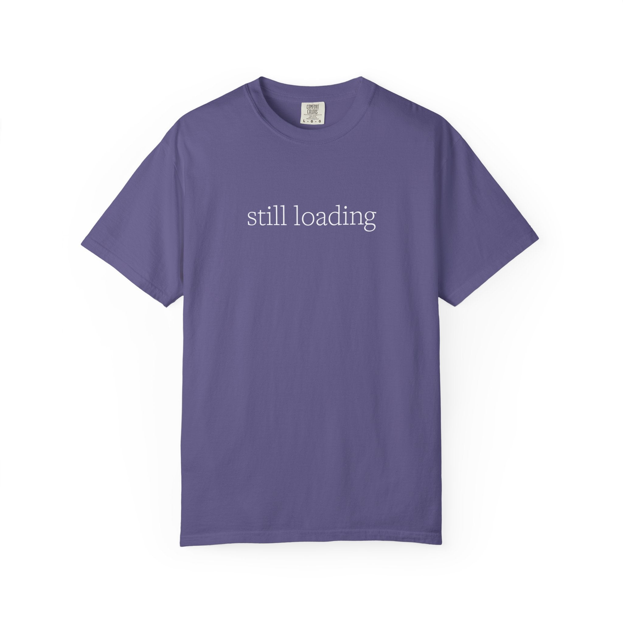 Purple t-shirt with 'still loading' text in white lettering